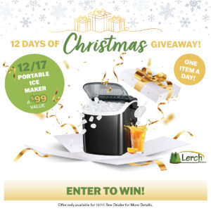 Black portable ice maker with ice cubes spilling out next to a glass of orange juice, featured in a Christmas giveaway promotion.